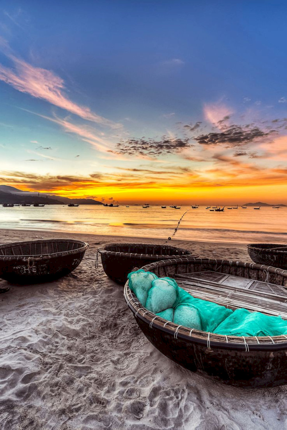 Capturing sunset moments with basket boats at An Bang beach